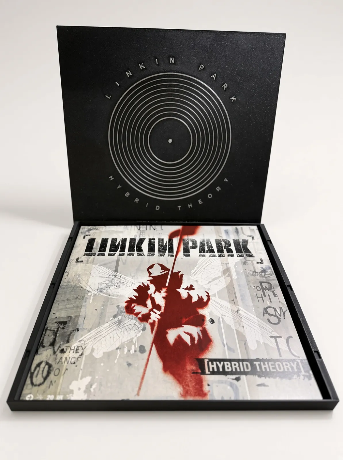 Engraved vinyl record box we printed, open with a Linkin Park Hybrid Theory LP resting inside