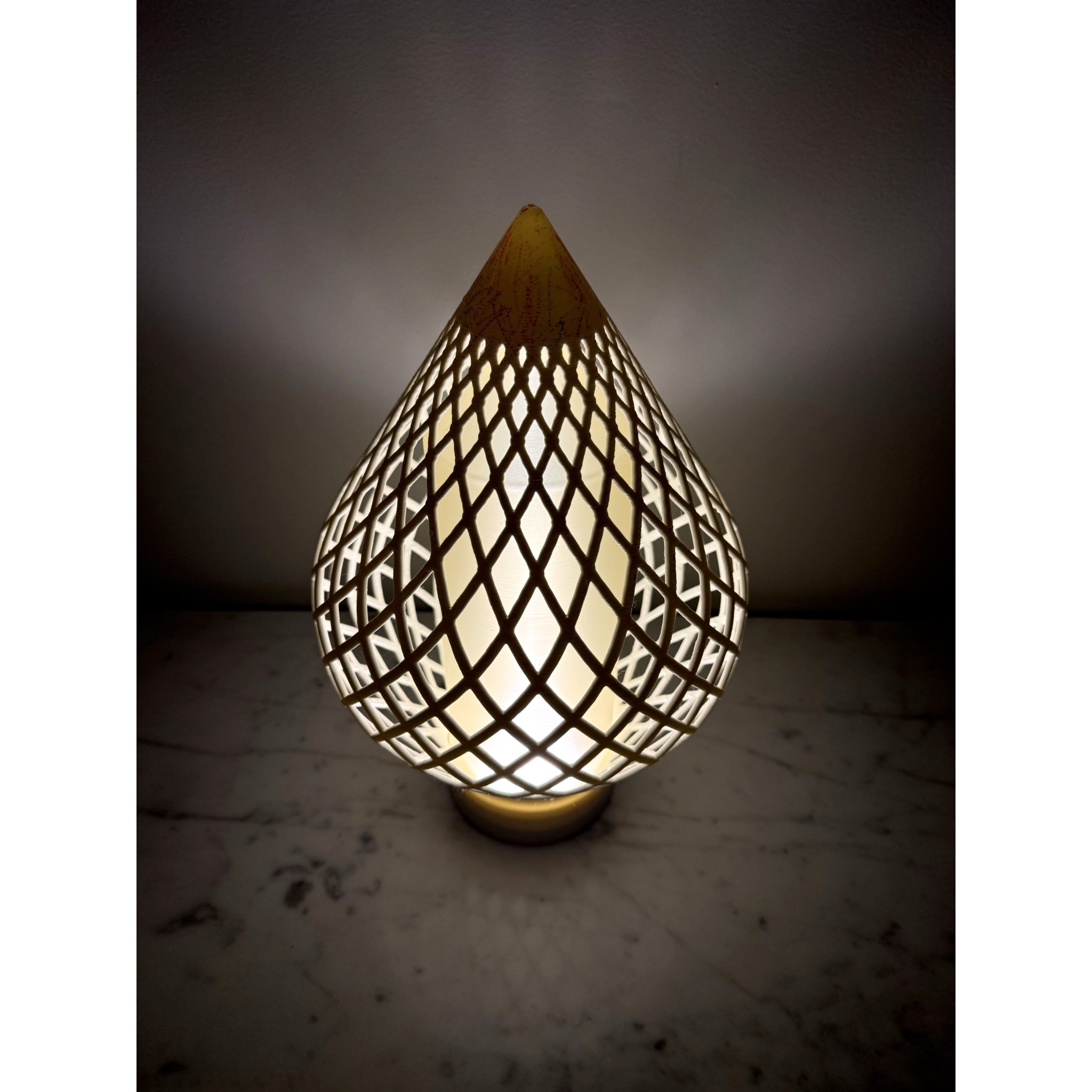 Reef Diagrid sculptural table lamp, lit — from Formada Studio